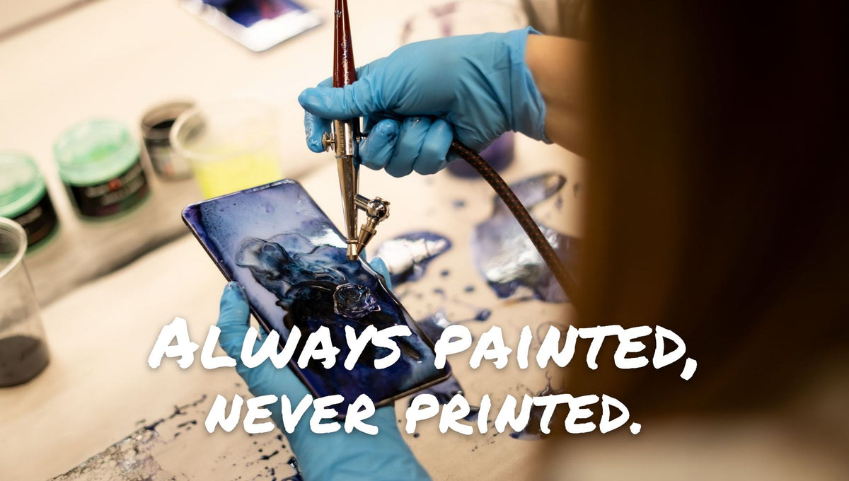 Person airbrushing epoxy resin