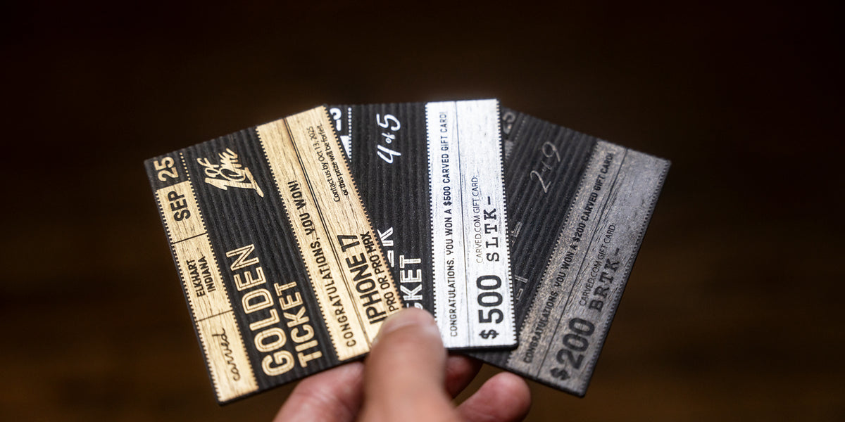 Hand holding 3 different tickets