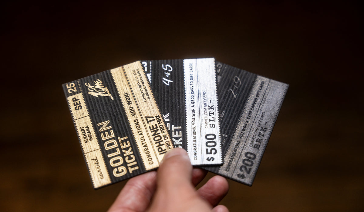 Hand holding 3 different tickets