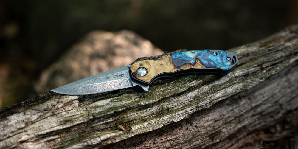 EDC Pocket Knife on log